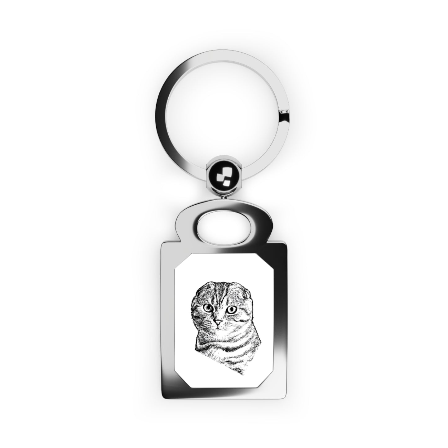 Keychain with a cat engraving on a white background