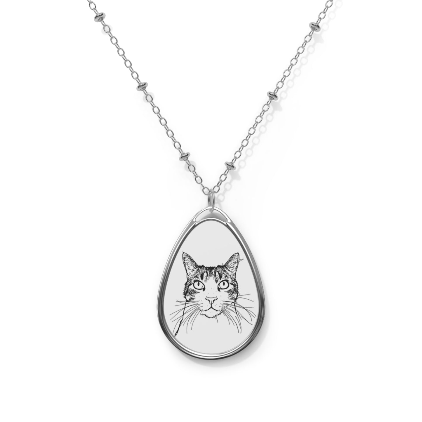 Teardrop-shaped pendant with a cat illustration on a white background