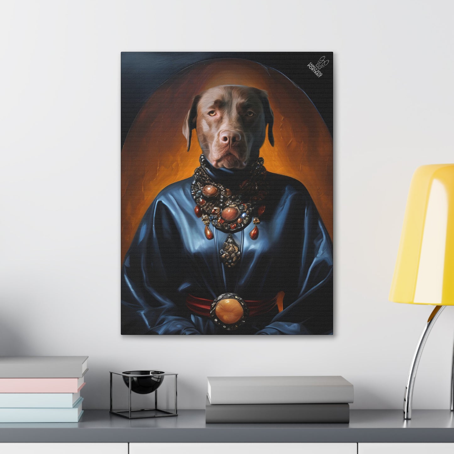 Framed portrait of a dog with a blue robe and orange background on a wall above a desk.