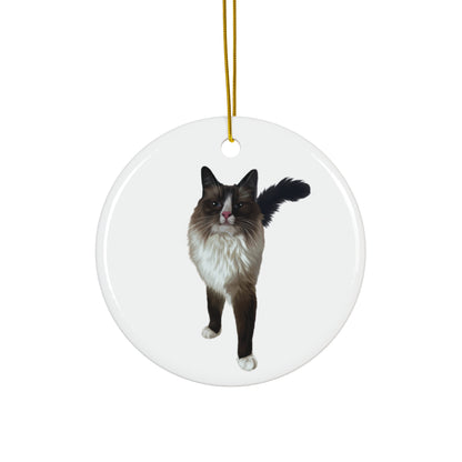 Round ceramic ornament with a black and white cat design on a white background