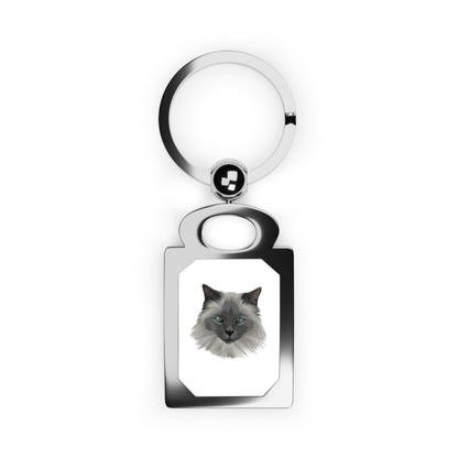 Keychain with a cat's face design on a white background