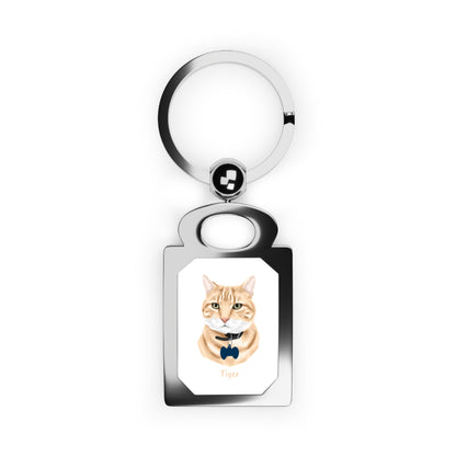 Keychain with a cat illustration and text on a white background