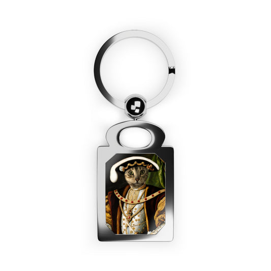 Keychain with a cat in regal attire design on a white background
