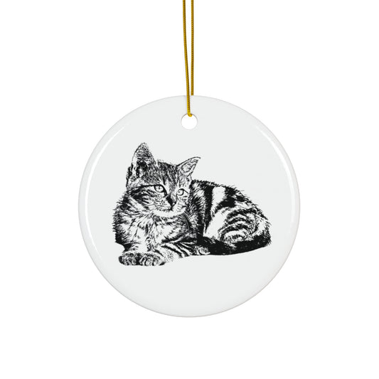 Round ceramic ornament with a black and white cat illustration on a white background