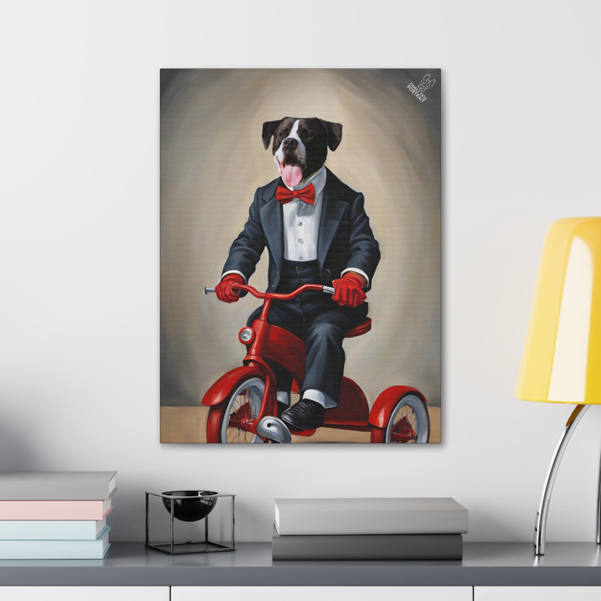 Canvas print of a dog in a suit riding a red tricycle on a wall above a shelf.