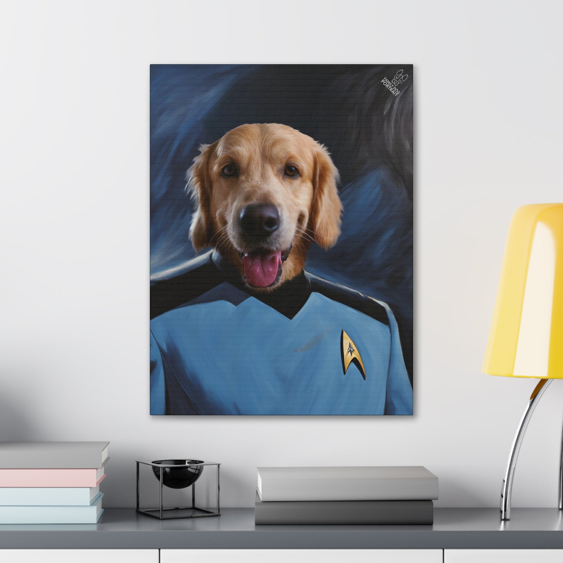 Framed artwork of a dog in a Star Trek uniform on a wall above a desk.