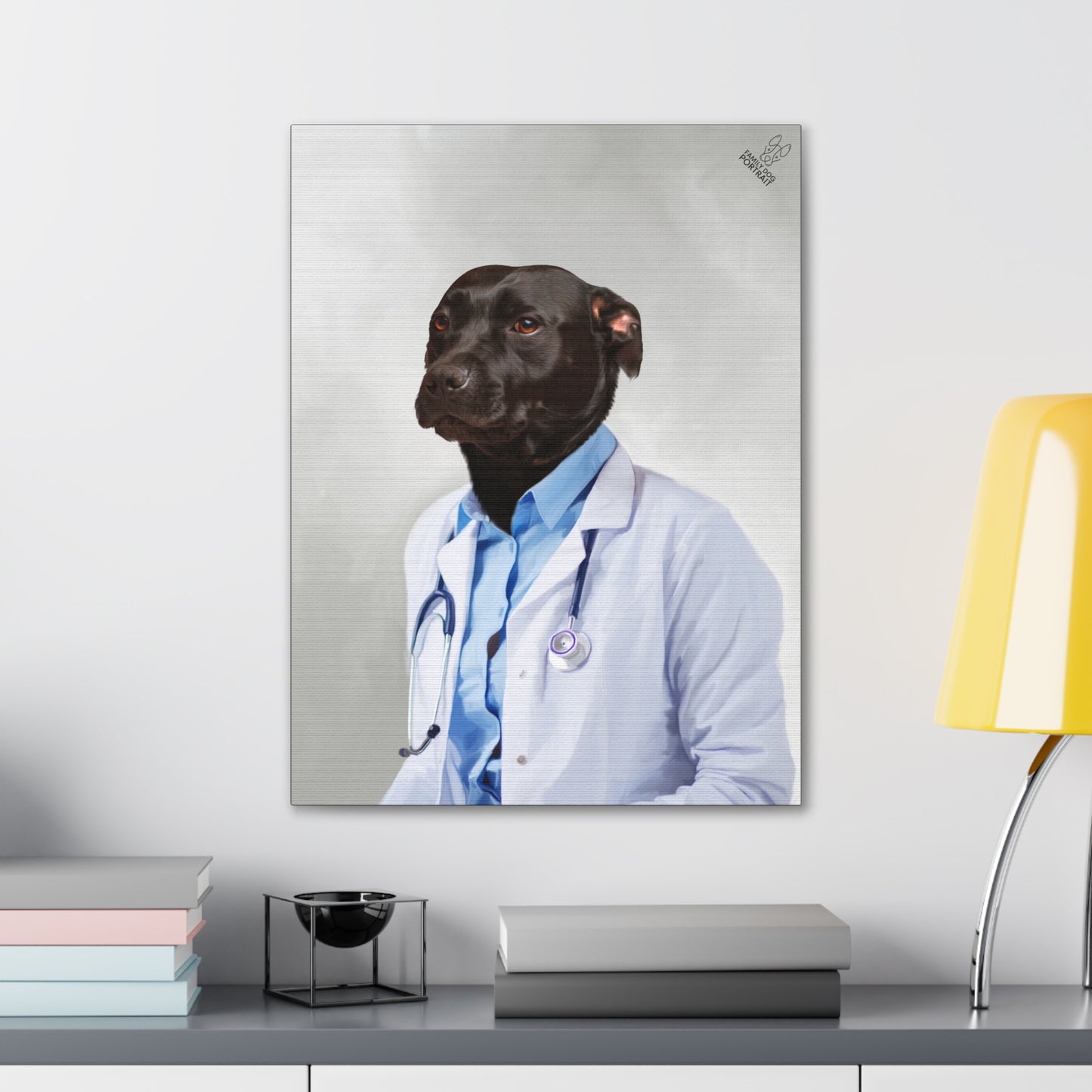 Framed artwork of a dog dressed as a doctor on a shelf with books and a lamp.