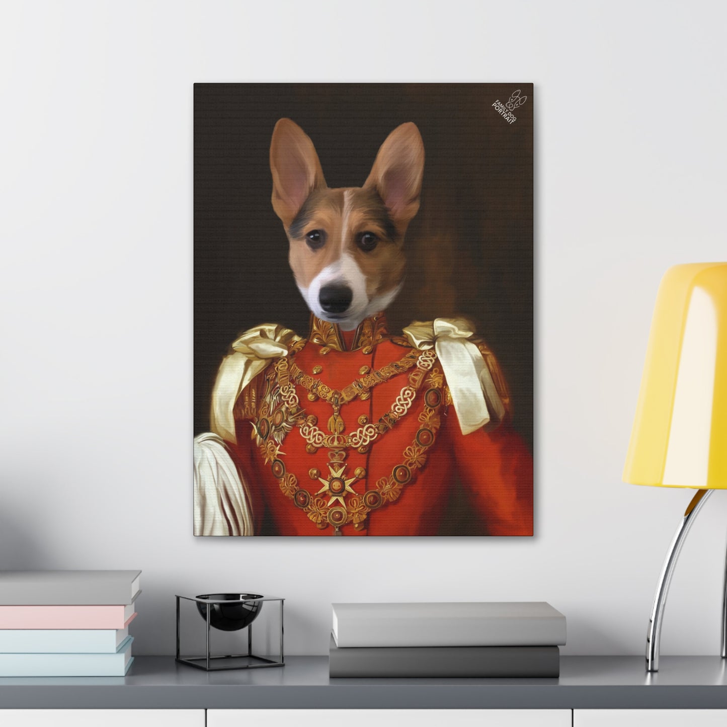 Framed portrait of a dog in regal attire on a wall above a desk.