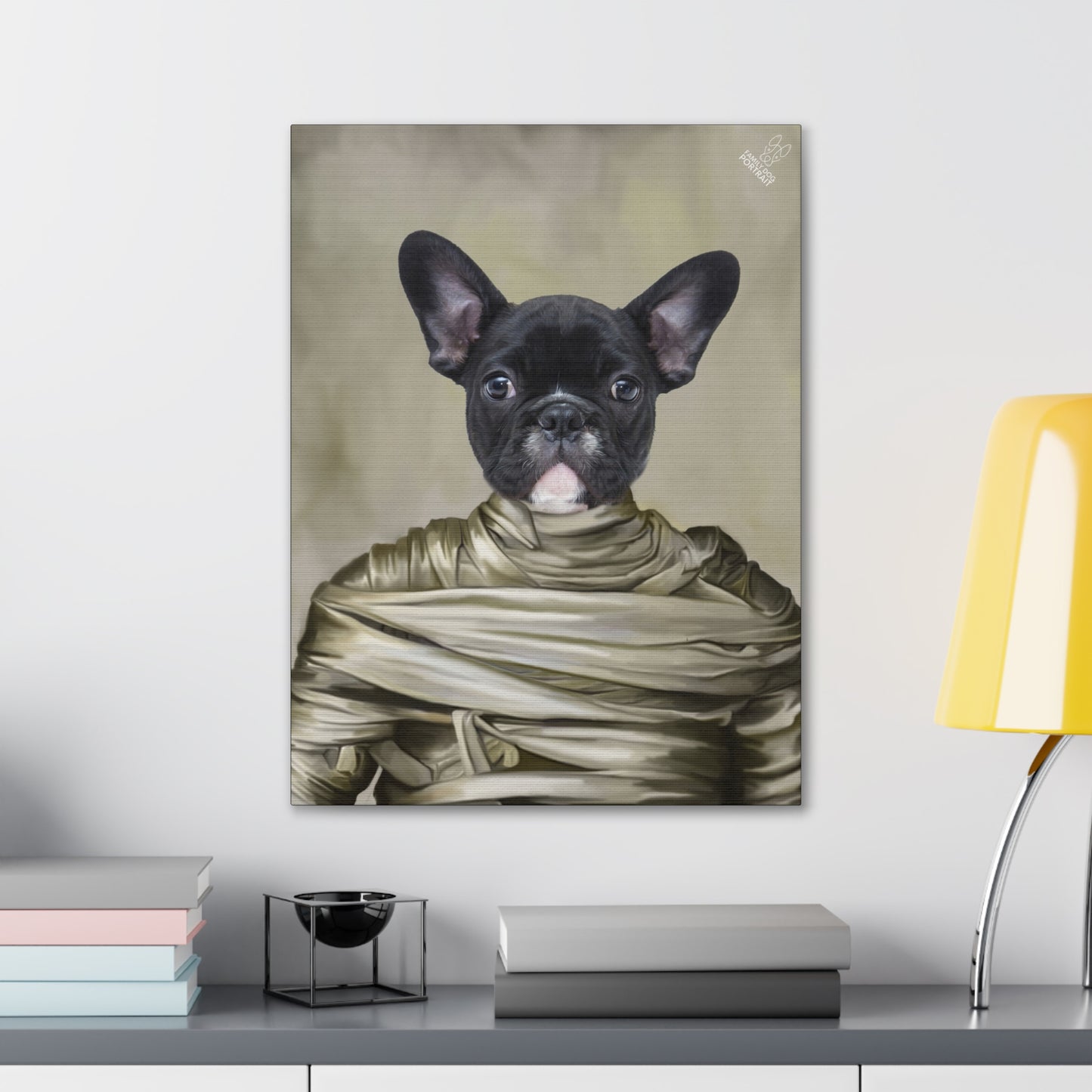 Canvas print of a black dog wrapped in bandages on a wall above a desk.
