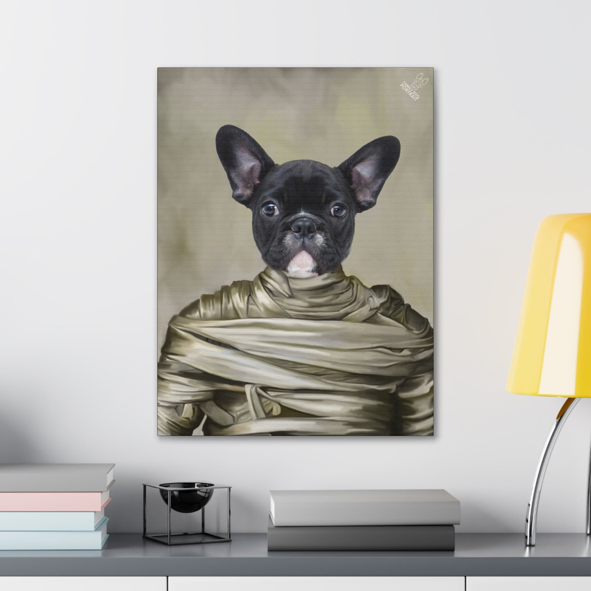 Canvas print of a black dog wrapped in bandages on a wall above a desk.