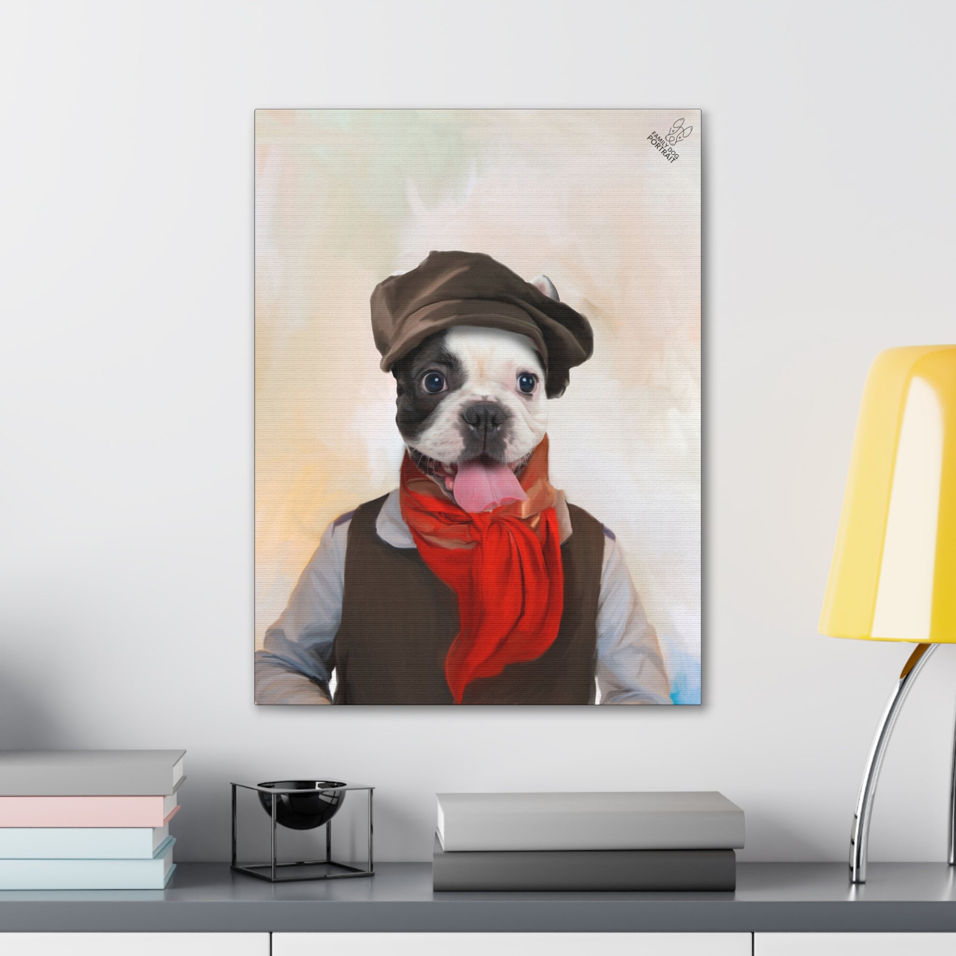 Canvas print of a dog wearing a hat and scarf on a table with books and a lamp.