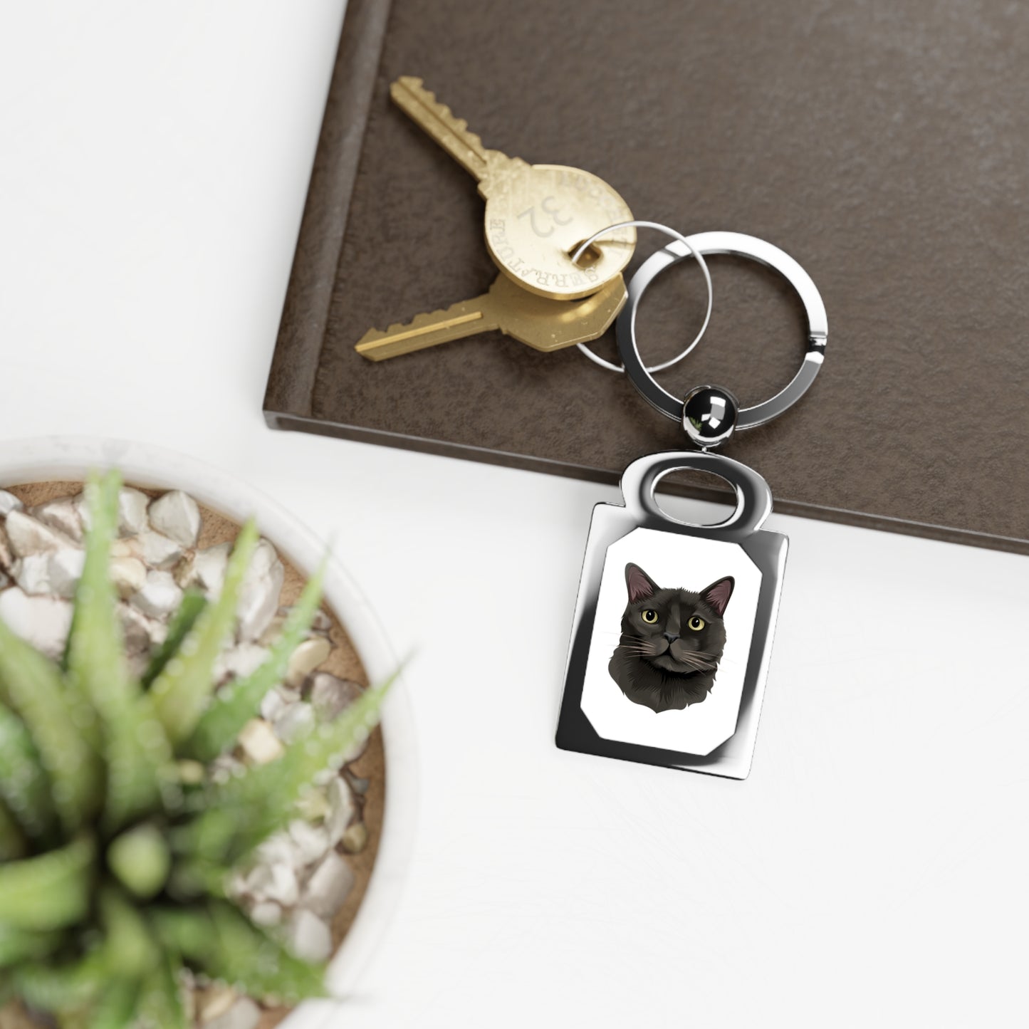 Rectangular key ring featuring a personalized cat design