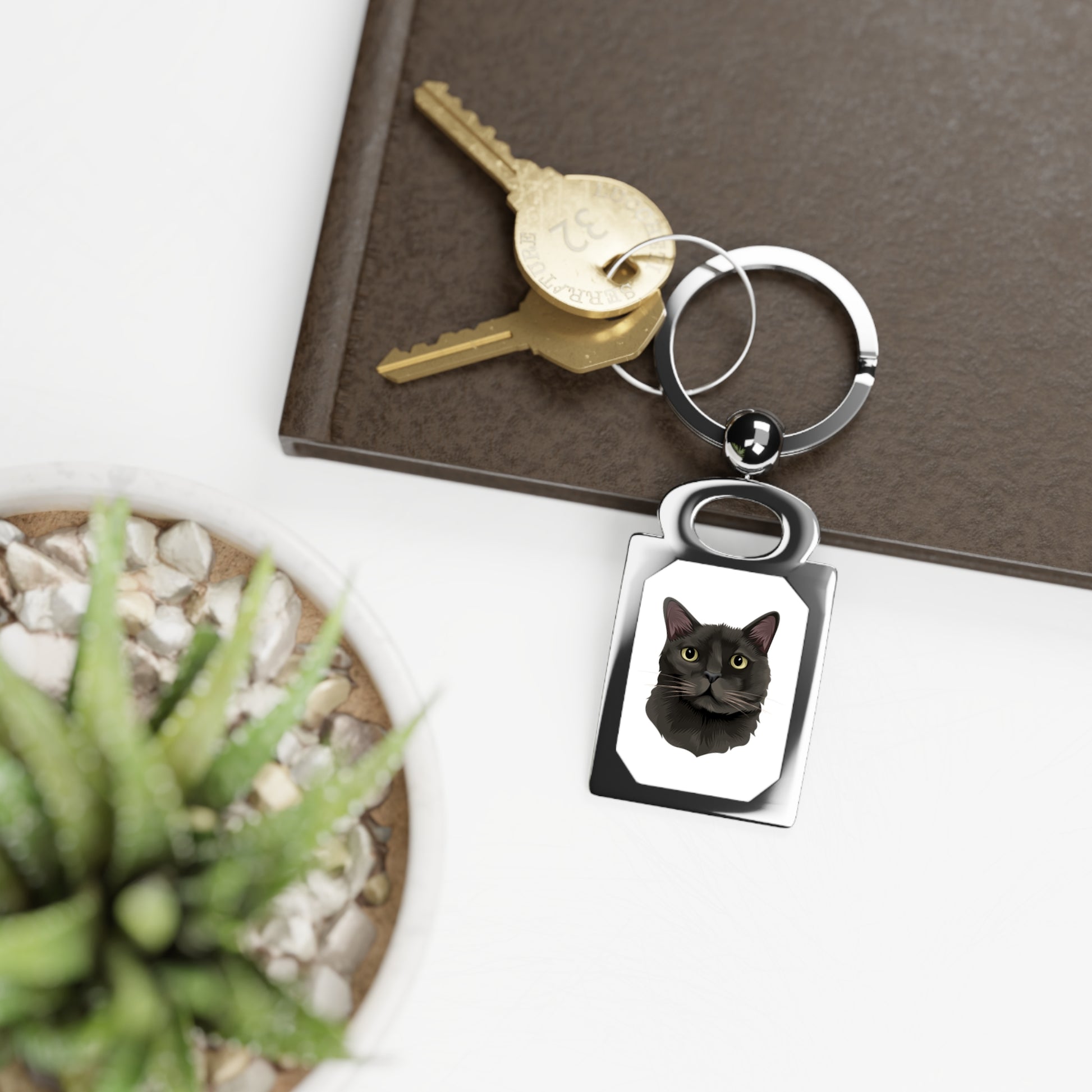 Rectangular key ring featuring a personalized cat design